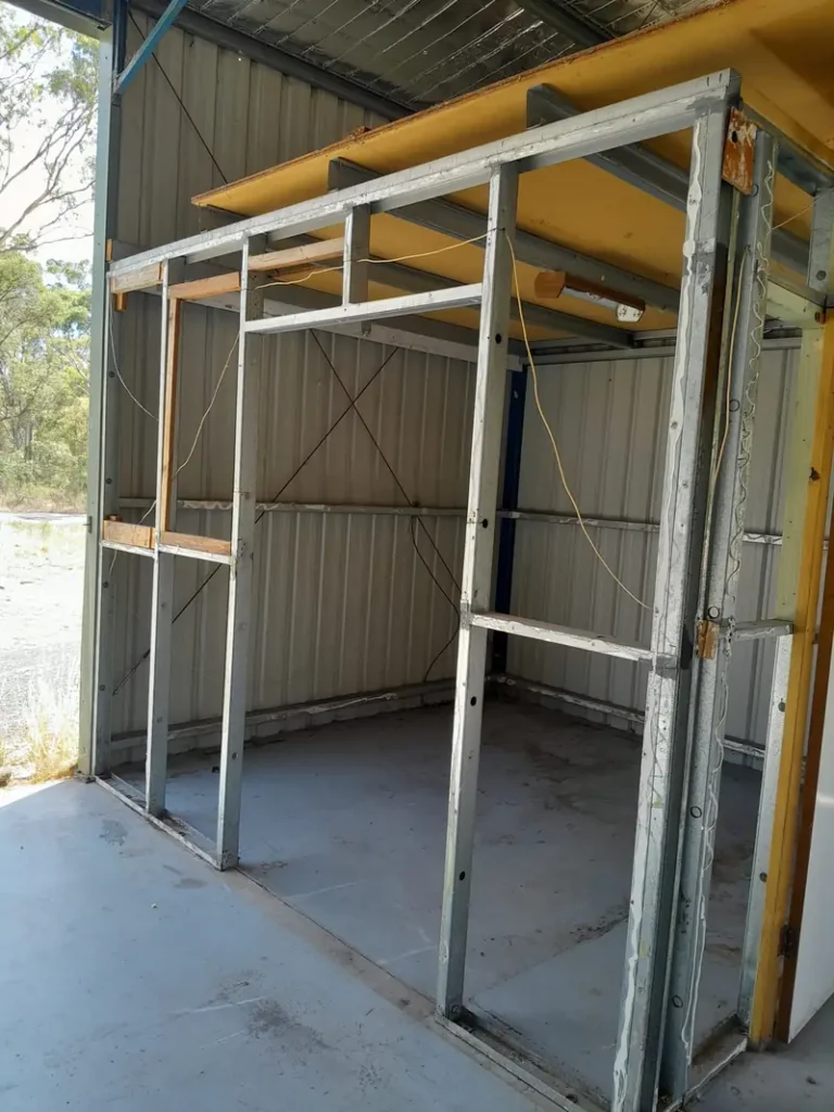 Internal room in a commercial shed stripped to its steel frame