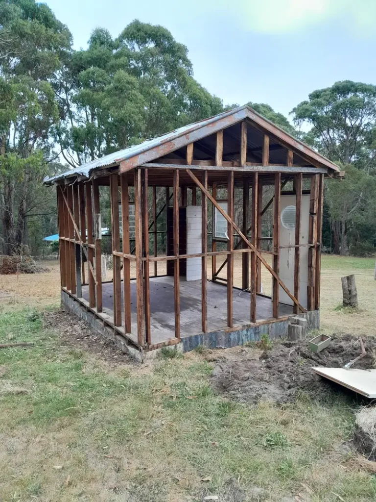 Shed stripped back to its timber frame after asbestos sheeting was removed